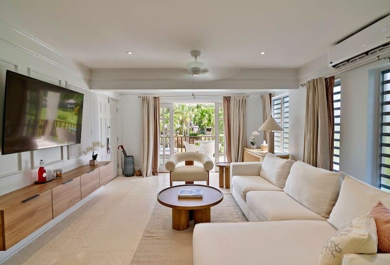 A typical inside layout of the Superior Deluxe Suite is primarily made up of white and beige décor.