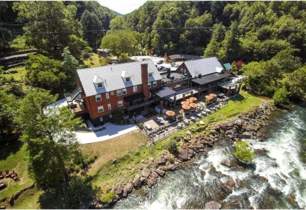 An exterior shot of the Lodge, the Tapoco Tavern’s outdoor seating, and, of course, the Cheoah River.