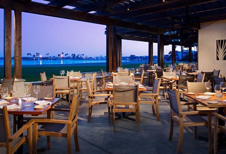 A restaurant patio overlooking the bay at dusk