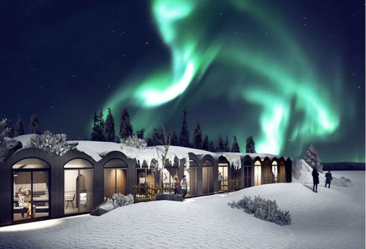 Apukka Resort cabins under the Northern Lights in Lapland, Finland – an upscale hotel experience on Journey Beyond Aspen.